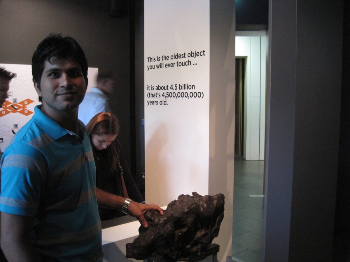 Prof. Ashish K Sharma touching meteorite at Glasgow Science Centre 2011